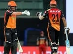 David Warner and Manish Pandey (right) in action against RCB in IPL 2021.