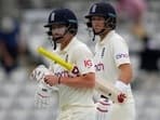 England's Rory Burns and England's Joe Root leave the pitch at the end of play on the second day of the Test against New Zealand