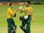 Quinton de Kock (L) and Reeza Hendricks celebrate South Africa's win.&nbsp;