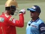 Punjab Kings captain KL Rahul chats with umpire