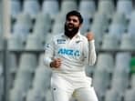 New Zealand's Ajaz Patel celebrates after picking a wicket