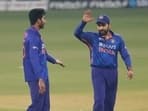 India's Venkatesh Iyer, left celebrates with India's captain Rohit Sharma the wicket of Sri Lanka's Chamika Karunaratne during the first T20I