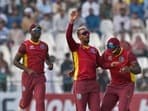 Nicholas Pooran celebrates with teammates after taking the wicket of Mohammad Rizwan