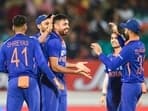 Indian bowler Avesh Khan celebrates with teammates after the wicket of South African batsman Dwaine Pretorius, during the 4th T20 cricket match.