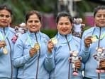 India's Lovely Choubey, Pinki, Nayanmoni Saikia and Rupa Rani Tirkey pose for photos after winning the Lawn Bowls Women's Fours gold at the Commonwealth Games 2022 (CWG).It was India's first ever medal finish in Lawn Bowls.