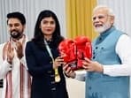 Nikhat Zareen poses for a photo with PM Narendra Modi.