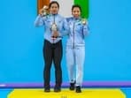 Indian weightlifter Bindyarani Devi Sorokhaibam with her idol Mirabai Chanu at the Commonwealth Games in Birmingham.&nbsp;