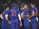 Harshal Patel (in middle) celebrates with Indian teammates