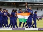 India's Jhulan Goswami and teammates celebrate after winning the match