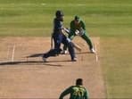 Moeen Ali attempts a single-handed reverse hit