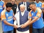 Prime Minister Narendra Modi with Rahul Dravid, Rohit Sharma and the ICC T20 Mens World Cup 2024 trophy, in New Delhi 


