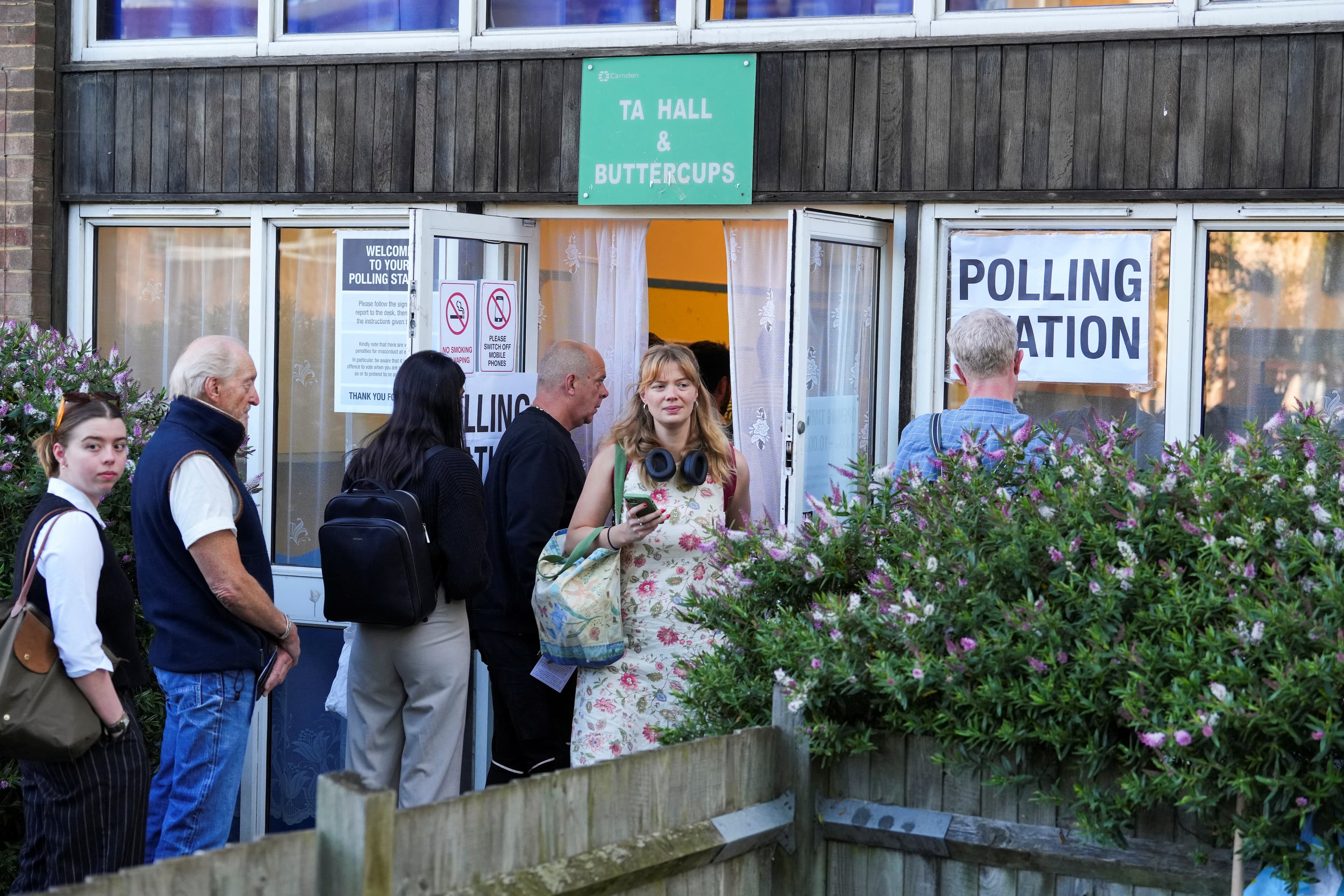 UK Election 2024 Live: People queue at a polling station to vote during the general election in London, Britain, July 4, 2024.  (REUTERS)