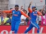 India's captain Rohit Sharma and Suryakumar Yadav celebrate the dismissal of South Africa's David Miller
