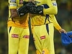 Chennai Super Kings' Matheesha Pathirana celebrating a wicket with MS Dhoni.