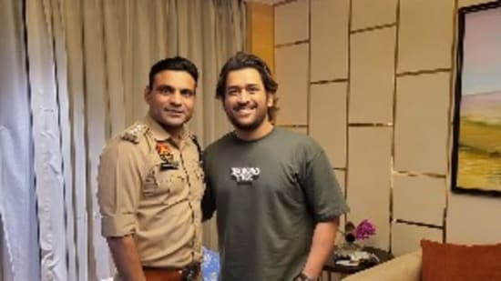 MS Dhoni poses for a photo with Joginder Sharma.