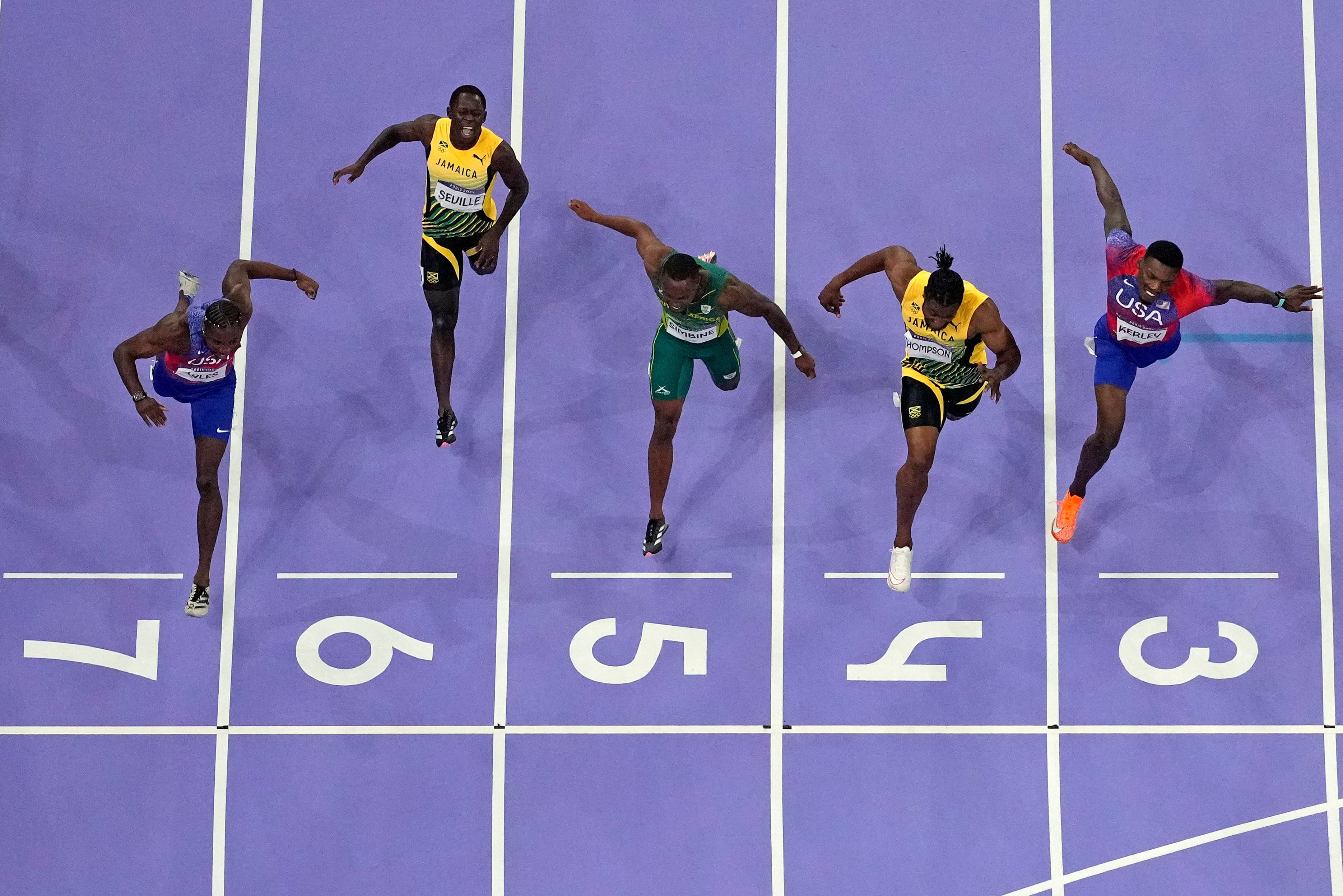 Noah Lyles, of the United States, in lane seven, wins the men's 100-meter final at the 2024 Summer Olympics (AP)