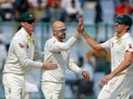 Australia's Nathan Lyon celebrates a wicket with teammates during the second day of the second test match against India, at Arun Jaitley Stadium
