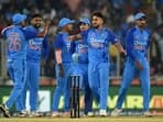 India's Umran Malik (2R) celebrates with teammates