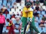 South Africa's Reeza Hendricks and Quinton de Kock celebrate after reaching a combined total of 100 runs