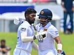 Sri Lanka's Nishan Madushka celebrates with his teammate Kusal Mendis (R) after scoring a double century (200 runs) during fourth day of the second and final cricket Test match between Sri Lanka and Ireland at the Galle International Cricket Stadium in Galle on April 27, 2023. (Photo by Ishara S. KODIKARA / AFP)