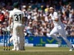Australia's David Warner looks on as England's Stuart Broad celebrates after taking his wicket caught by Zak Crawley