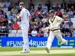 Australia's David Warner, right, runs past England's Stuart Broad to score during the first day of the third Ashes Test 