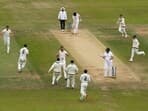 Mitchell Starc celebrates with teammates after bowling out Jonny Bairstow 
