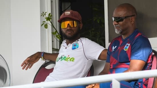 Kraigg Brathwaite (L) and coach Andre Coley (R) of West Indies