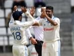 Ravichandran Ashwin (R) and Virat Kohli (L) during the 1st Test vs West Indies