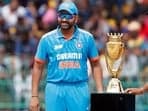 India's skipper Rohit Sharma pose for a photo in front of the trophy ahead of their Asia Cup 2023 final match, at R.Premadasa Stadium, in Colombo