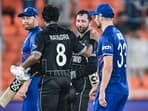 New Zealand's Rachin Ravindra (2L) and Devon Conway (2R) celebrate after winning the 2023 ICC men's cricket World Cup one-day international (ODI) match
