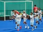India's captain Harmanpreet Singh celebrates with teammates after scoring a goal against Japan during the Men's Hockey Final match at the 19th Asian Games, in Hangzhou, China