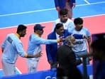 India players argue with a referee on a disputed decision in the men's kabaddi gold medal match between India and Iran during the Hangzhou 2022 Asian Games in Hangzhou, in China's eastern Zhejiang province
