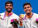 Chirag Shetty and Satwiksairaj Rankireddy pose for photos during the presentation ceremony after winning the men's doubles gold 