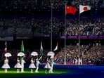 China's and Japan's national flags are seen during the closing ceremony of Hangzhou, Asian Games