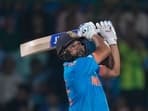 Rohit Sharma hits a six during the ICC Men's Cricket World Cup match between Afghanistan and India.