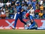 Rahmanullah Gurbaz (R) reacts after his dismissal during the 2023 ICC Men's Cricket World Cup one-day international (ODI) match between England and Afghanistan