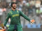 Heinrich Klaasen celebrates after scoring a century during the 2023 ICC Men's Cricket World Cup match between England and South Africa