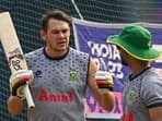 South Africa's Gerald Coetzee (L) speaks during a practice session