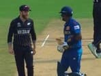 Kane Williamson (L) chats with Angelo Mathews as the Sri Lanka batter walks out to bat