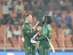 Ahmedabad: South Africa's batters Andile Phehlukwayo Rassie van der Dussen celebrate their win in the ICC Men's Cricket World Cup 2023 match between Afghanistan and South Africa, at Narendra Modi Stadium, in Ahmedabad, Friday.