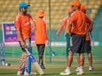 India's captain Rohit Sharma, left, speaks to head coach Rahul Dravid during a practice session 