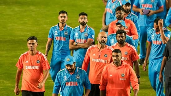 India's head coach Rahul Dravid, skipper Rohit Sharma and other players after the ICC Men's Cricket World Cup 2023 final at the Narendra Modi Stadium in Ahmedabad