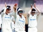 India Women's Deepti Sharma and teammates celebrate her five-wicket haul during Day 2 of the One-off test match against England Women, at Dr DY Patil Sports Academy in Navi Mumbai on Friday