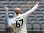 Australia's Nathan Lyon celebrates after taking the wicket of Pakistan's Imam-ul-Haq 