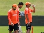 Centurion: India's coach Rahul Dravid with skipper Rohit Sharma and KL Rahul during a practice session ahead of the first Test cricket match between India and South Africa, in Centurion, South Africa
