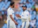 India's captain Rohit Sharma with bowler Prasidh Krishna