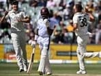 Australia's Josh Hazlewood (R) celebrates the wicket of Alick Athanaze during day two of the first cricket Test match between Australia and the West Indies at the Adelaide Oval
