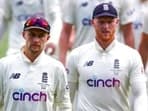 England's Joe Root, left, walks from the field with captain Ben Stokes
