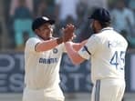 India's Rohit Sharma celebrates a wicket with Sarfaraz Khan during the 3rd Test 